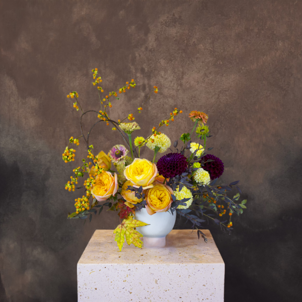 Autumn-themed floral centerpiece with oranges, golds, and browns, perfect for Thanksgiving or fall decor in Los Angeles.