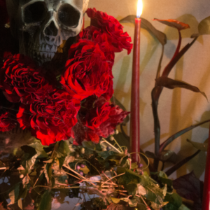 Halloween floral design with deep red flowers, suited for romantic, dark-themed gatherings and decor.