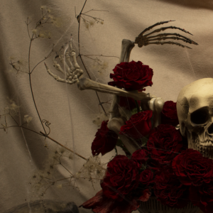 Halloween floral design with deep red flowers, suited for romantic, dark-themed gatherings and decor.