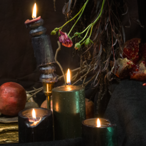 Gothic Halloween floral arrangement with dark blooms, a black raven, and antique-style urn for party decor in Los Angeles.