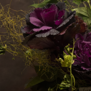 Edgy bouquet with thorny accents and dark blooms, great for gothic Halloween decor and Los Angeles events.